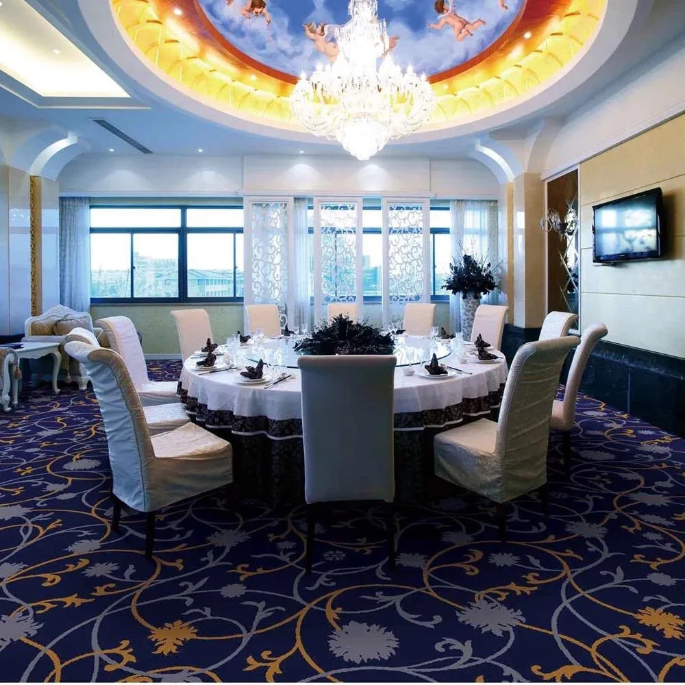Banquet hall dining space with patterned carpet